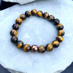 10mm Brown Tiger's Eye Beaded Bracelet with Hematite Accent Bead