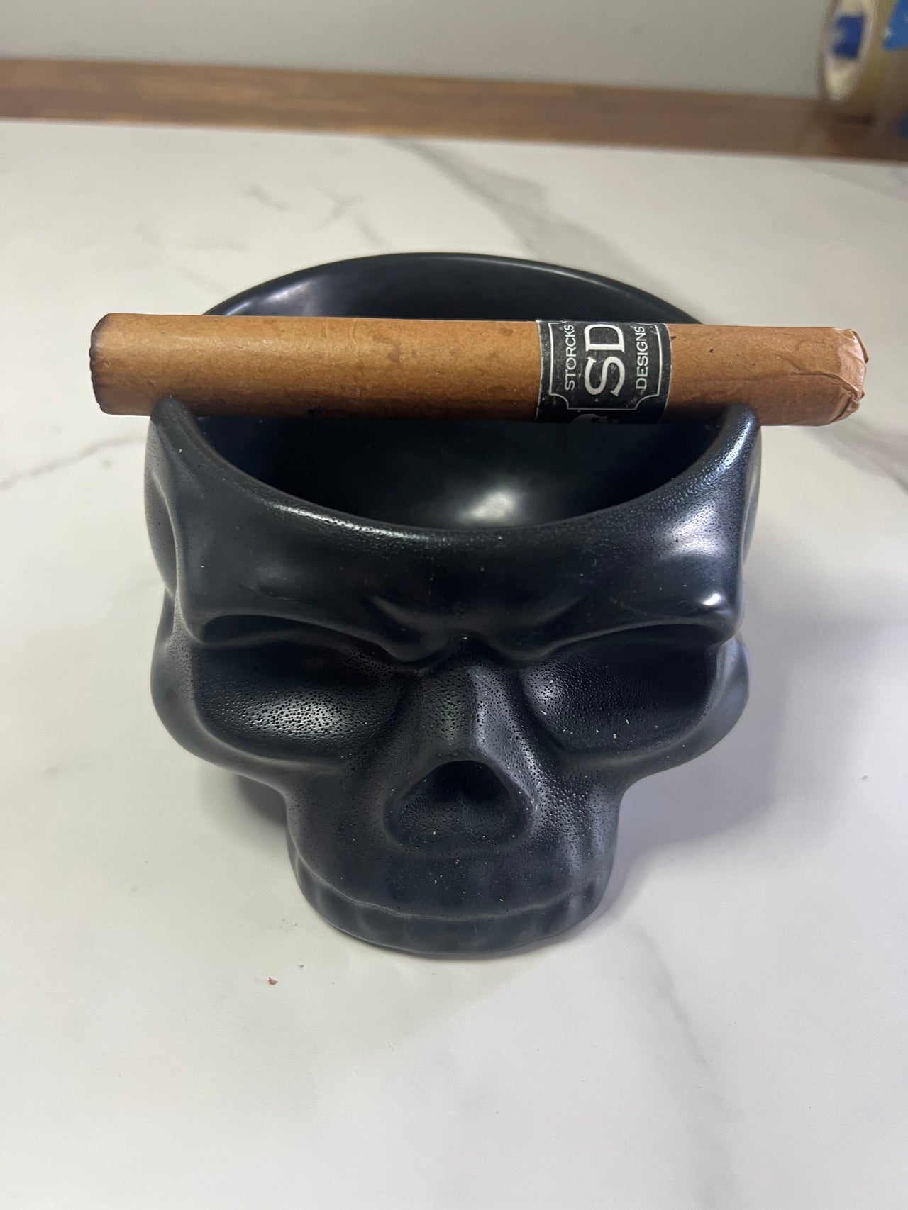 A - concrete black skull cigar bowl