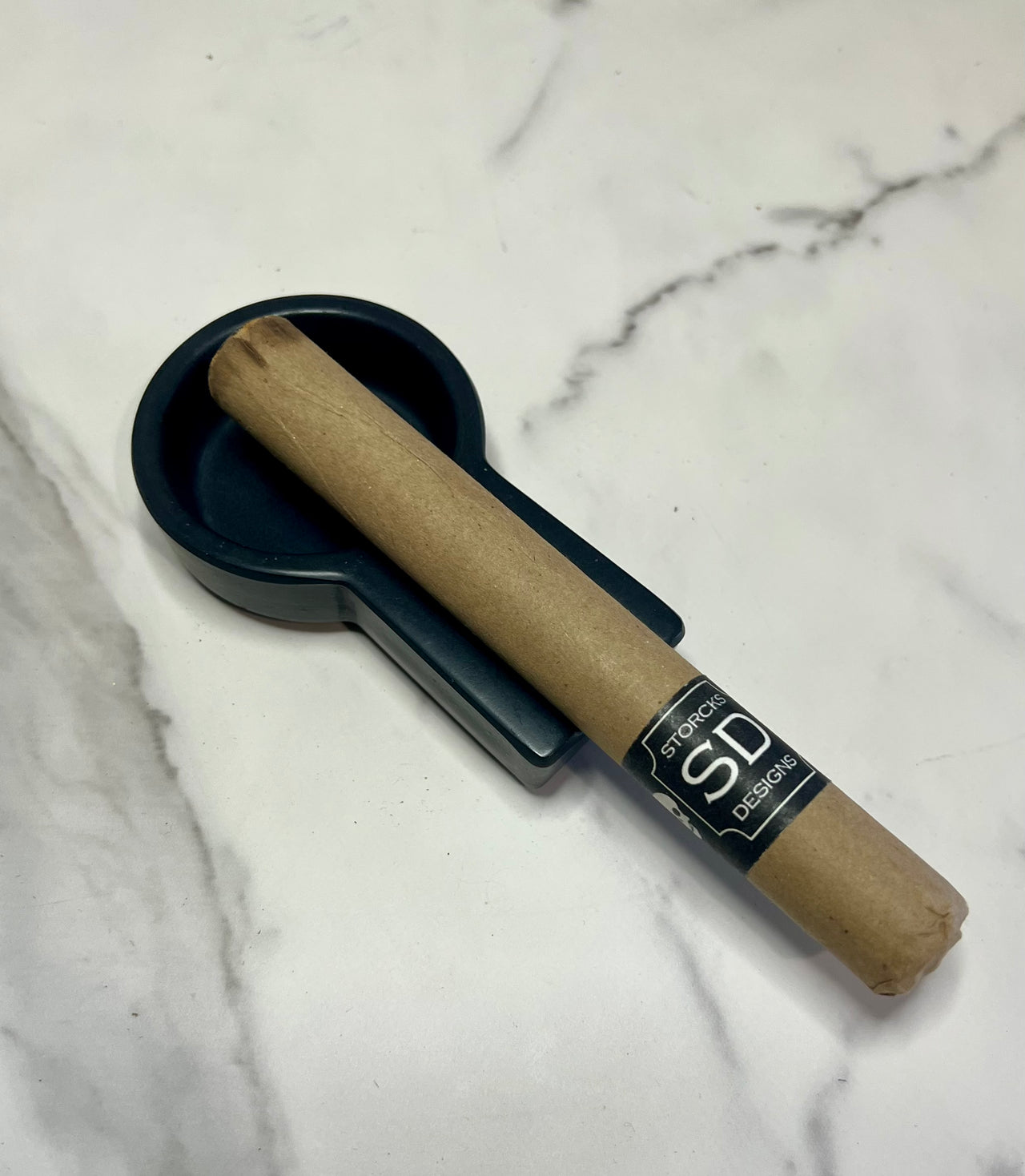black small concrete cigar ashtray